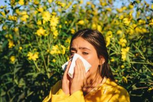 Woman-with-allergies-Better-Homes-Gardens-Real-Estate-Steinborn-Associates-